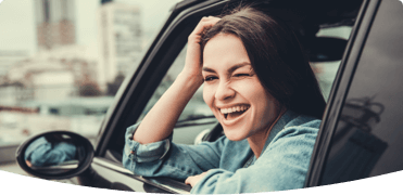 girl leaning our of car window